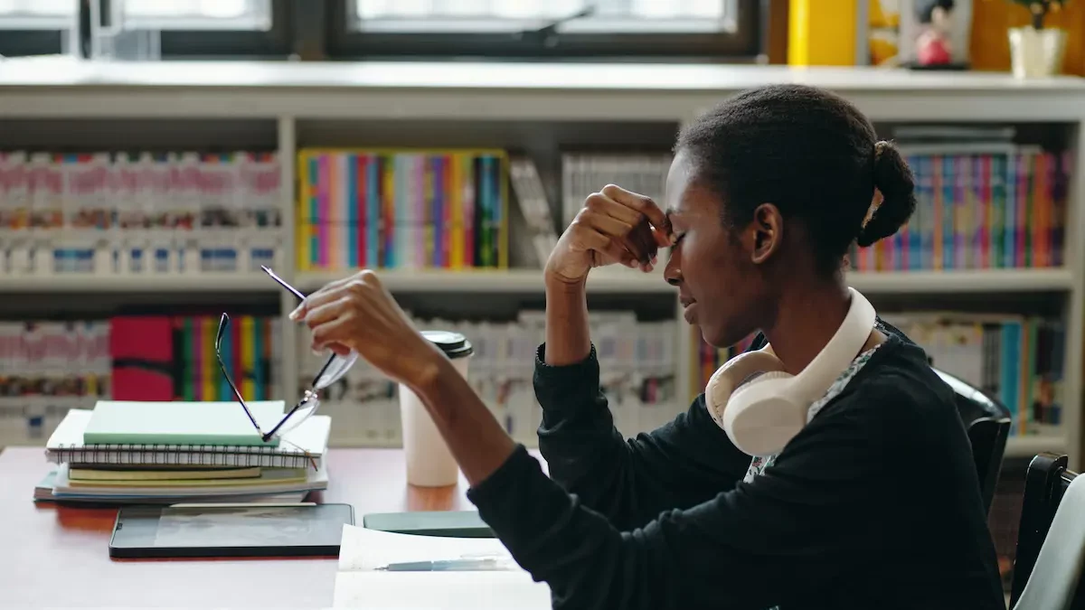 Young female teacher visibly frustrated and dealing with teacher burnout.