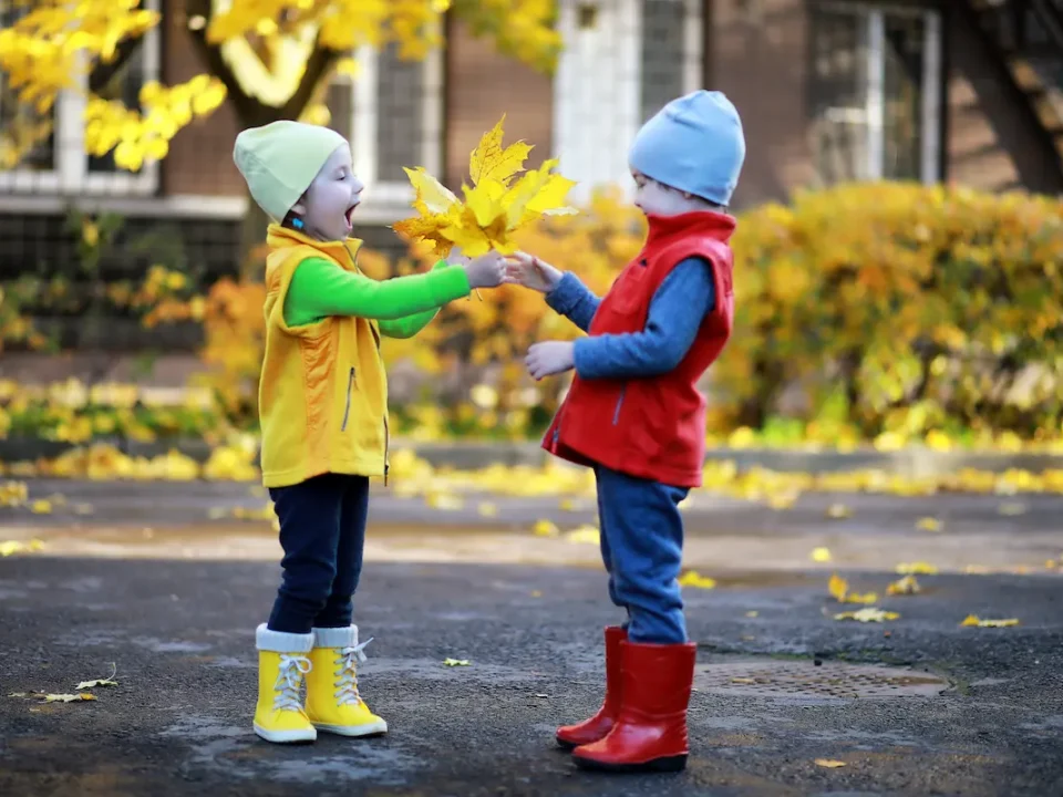 Two children show gratitude in Autumn.