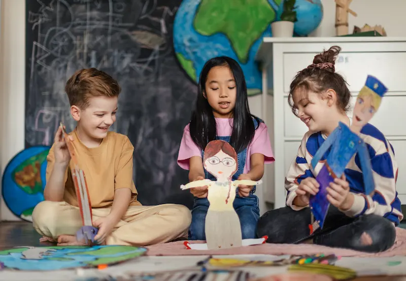 Kids learning about feelings using puppets