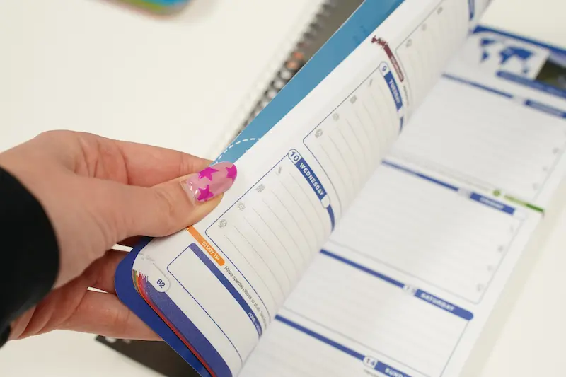  A student flips through her own datebook
