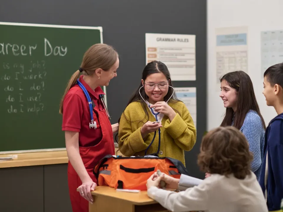 Woman demonstrates medical career to students at school